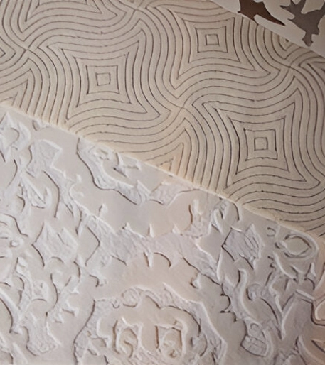 A close up of some white patterned paper