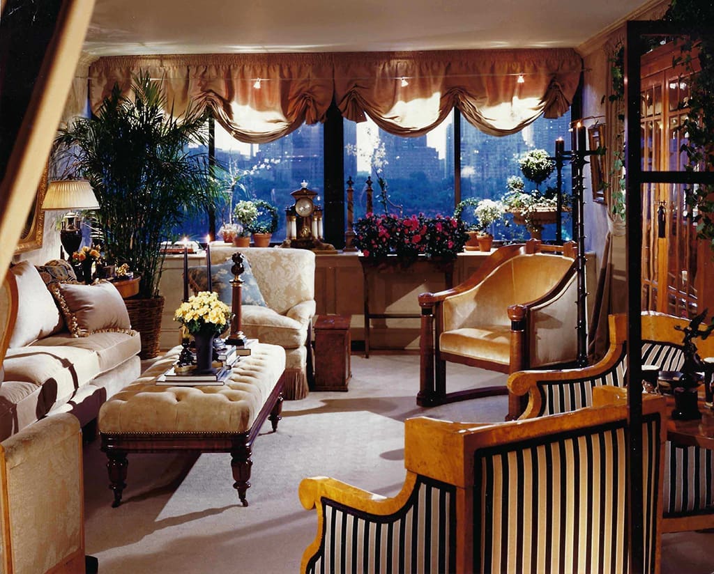 A living room with many chairs and furniture